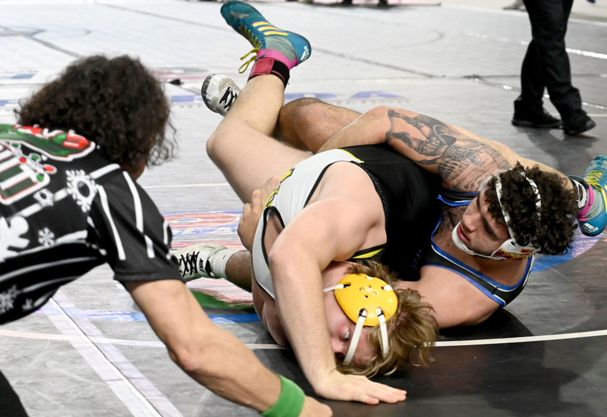Aaron Riner of Buford gets a win against Cooper Gentle of McCallie School during a 215-pound semifinals match on Saturday at the Knockout Christmas Classic at Silver Spurs Arena in Kissimmee. 